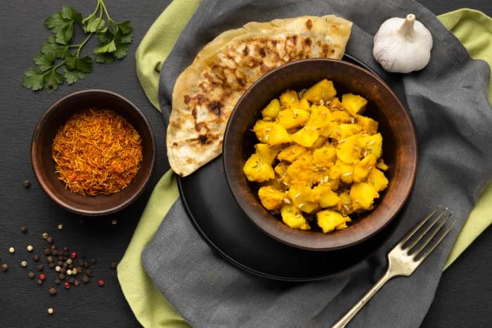 Indian curry served with fresh naan bread